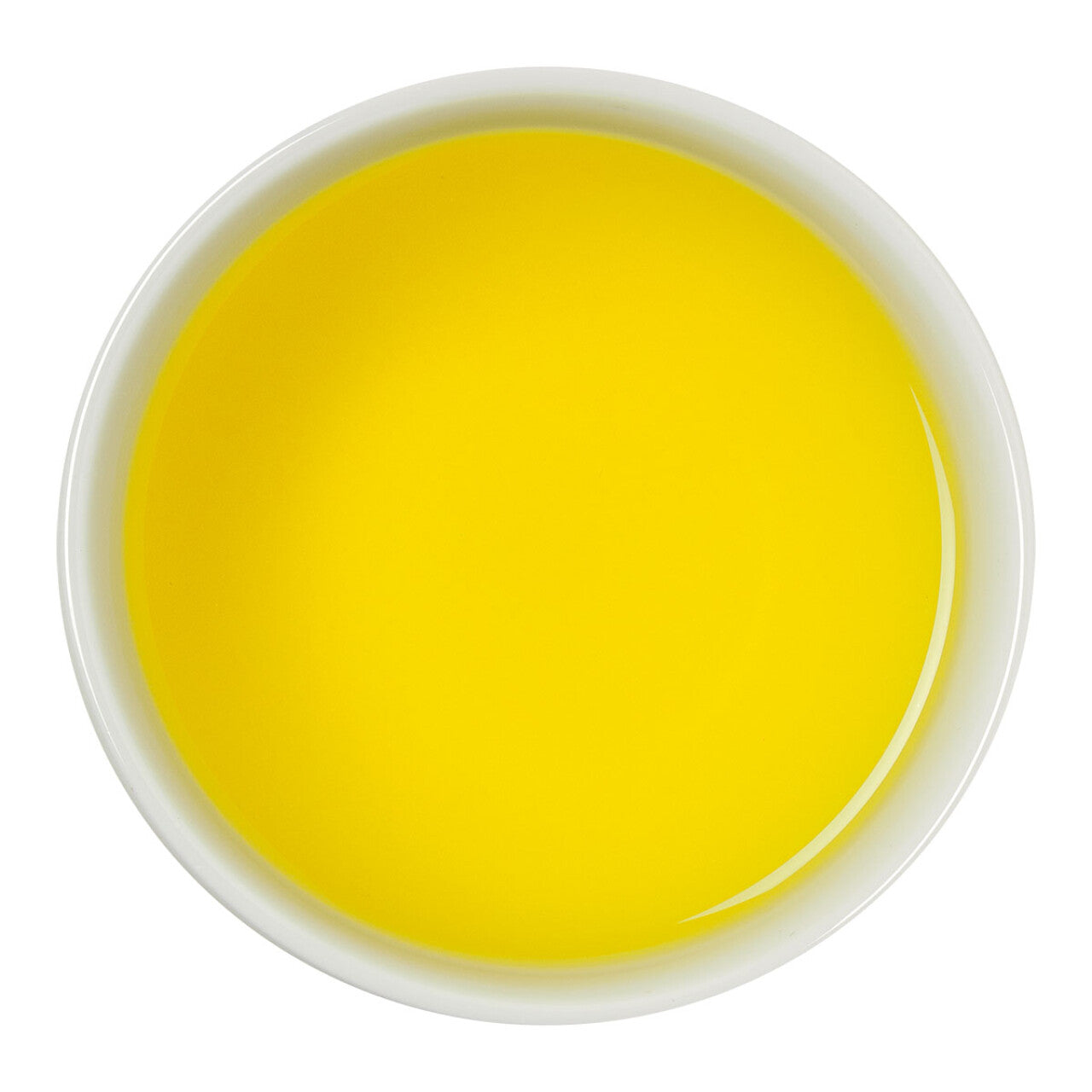 Brewed fruit tea with citrus, pineapple, and apple in a bright yellow infusion