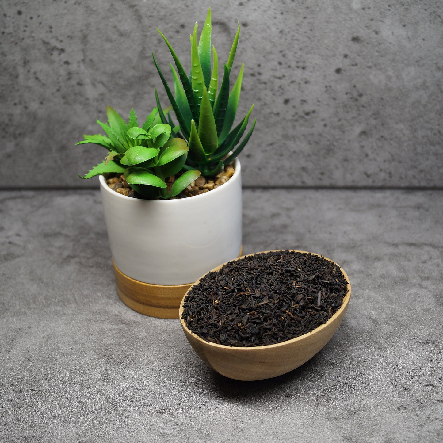 Loose leaf Lapsang Souchong Chinese black tea leaves on wooden surface