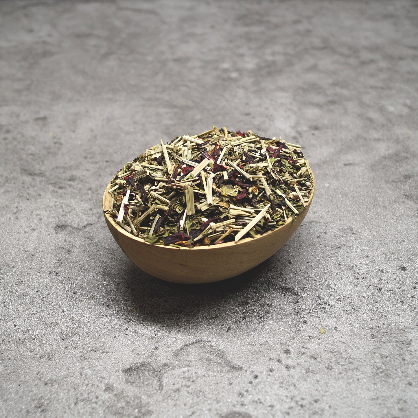 Loose leaf Morning Star tea with visible peppermint, grapefruit zest, and lemongrass