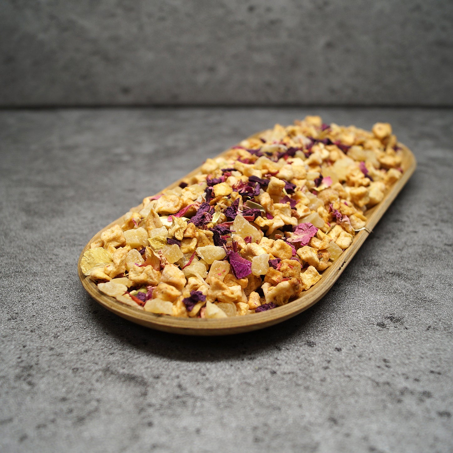 Close-up of pink loose leaf tea with pineapple pieces