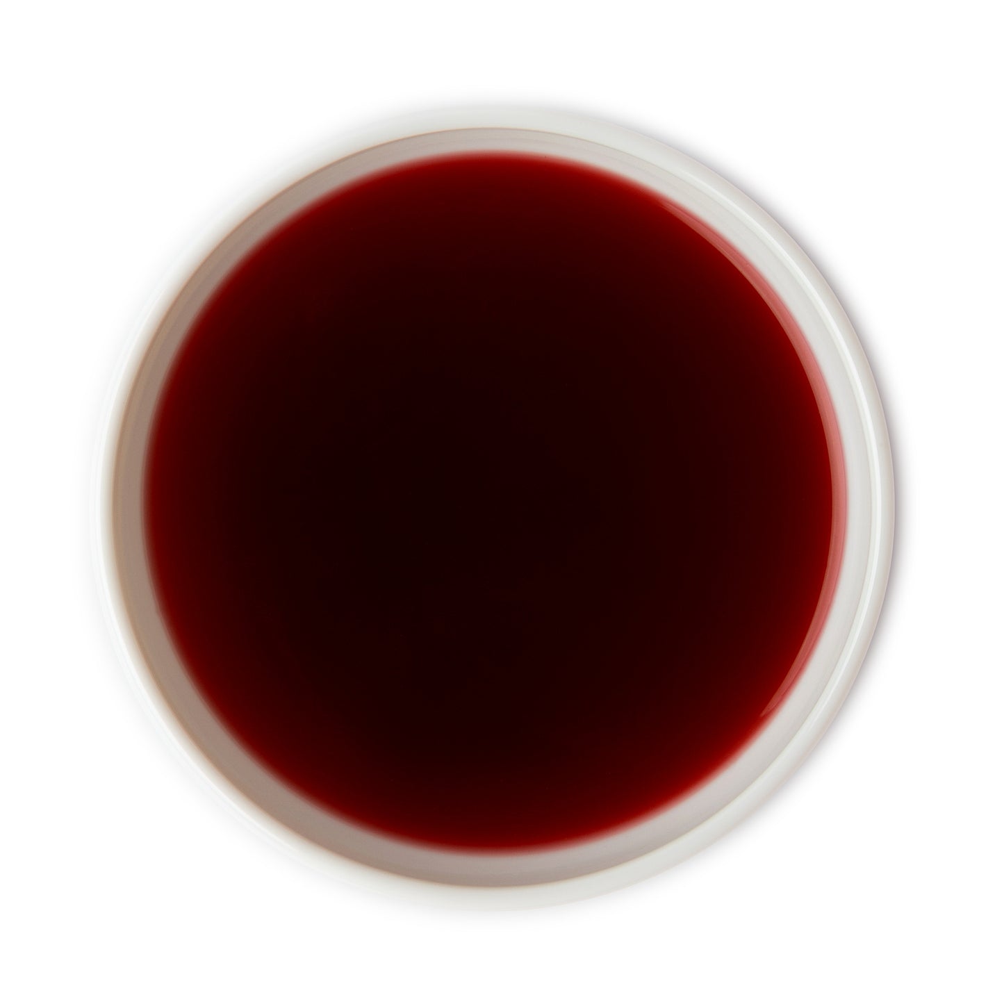 Brewed wild berry tea with a rich, deep red color