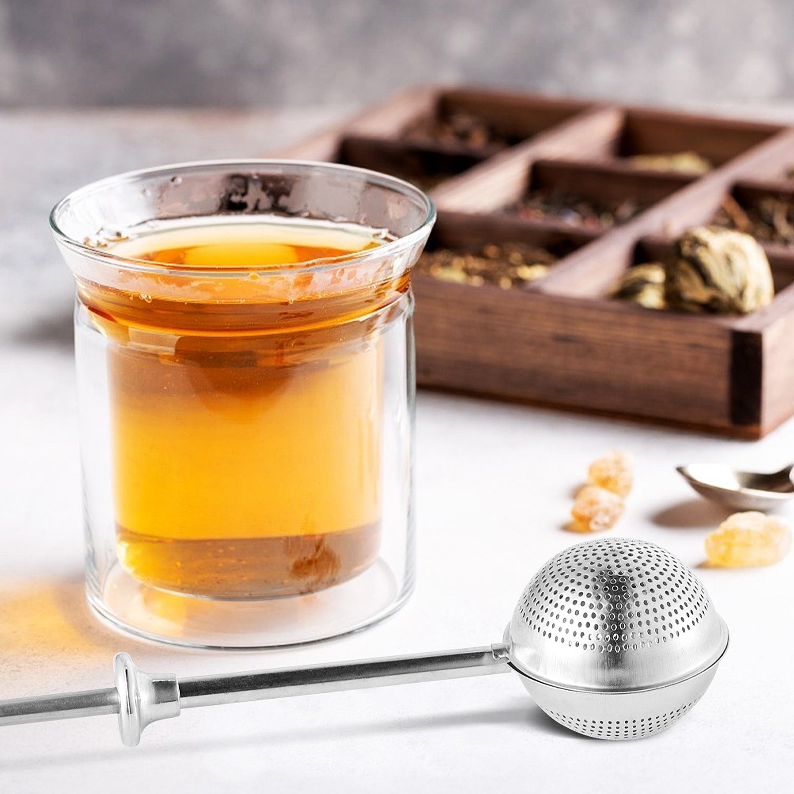 Preparing black tea using infuser tong – luxury tea experience