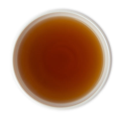 Brewed Darjeeling Second Flush black tea in cup – dark amber infusion