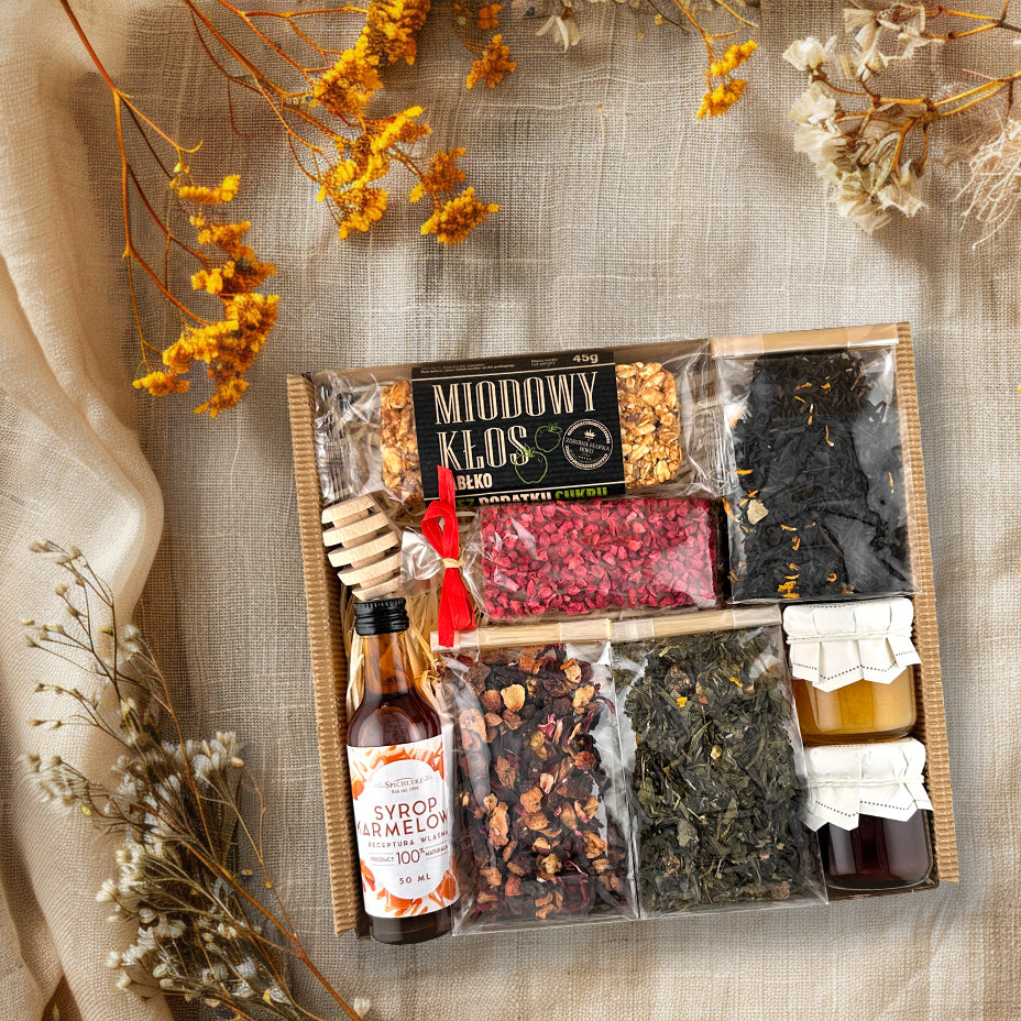 Gift basket with tea and sweets for easter presents