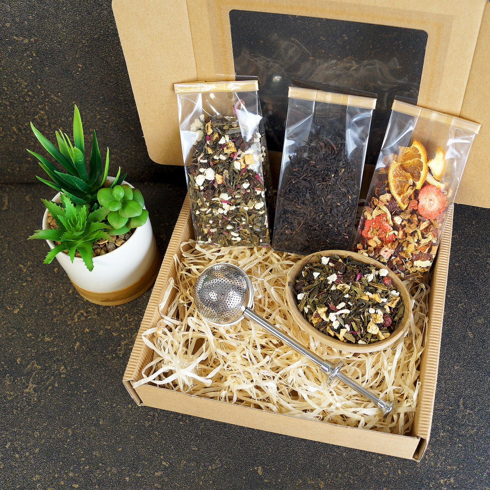 Open view of black tea gift box with premium loose leaf tea and tea infuser - perfect gift for mom